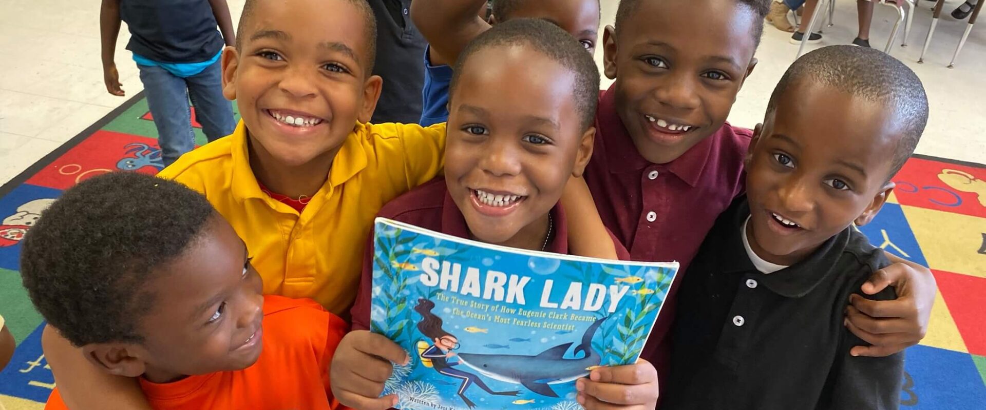 Kids reading about sharks in class
