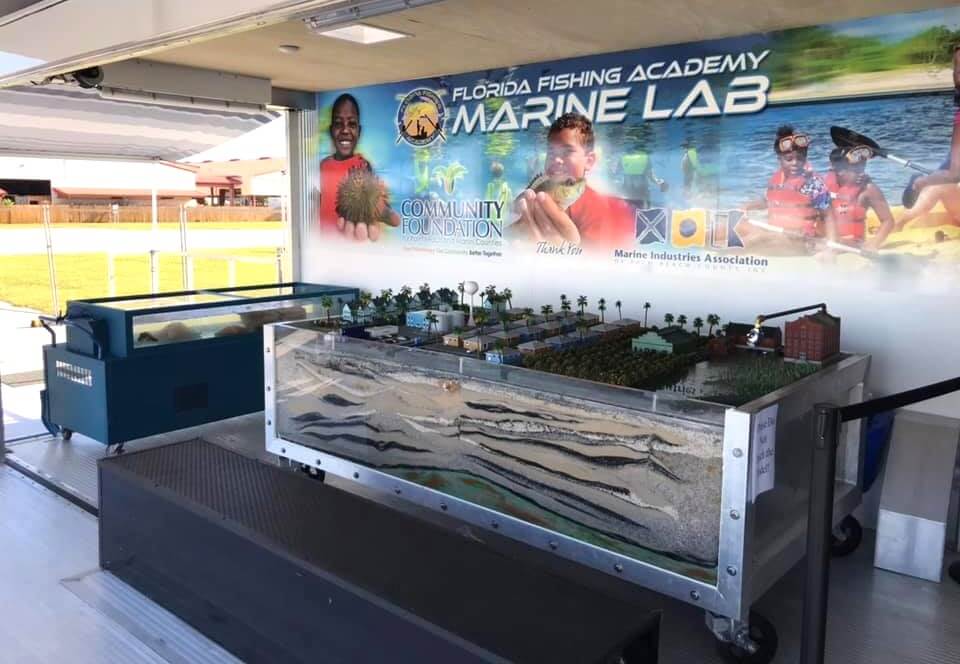 Mobile Marine Lab with touch tank and display of the watershed with sand aquifer.