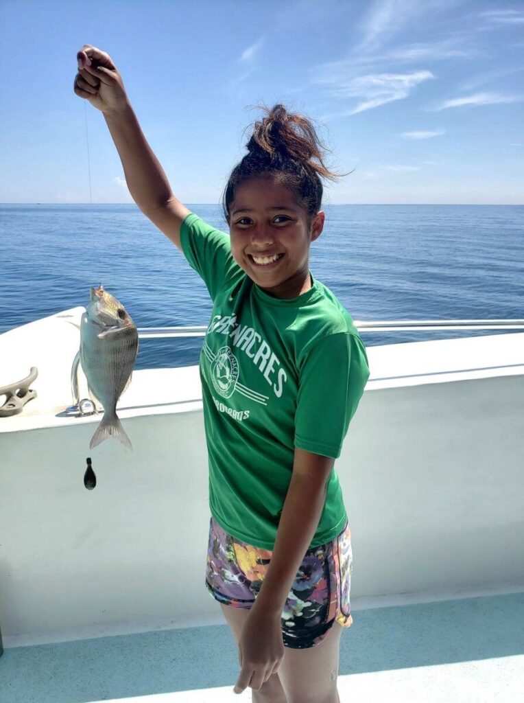 Young girl with her fishing catch.