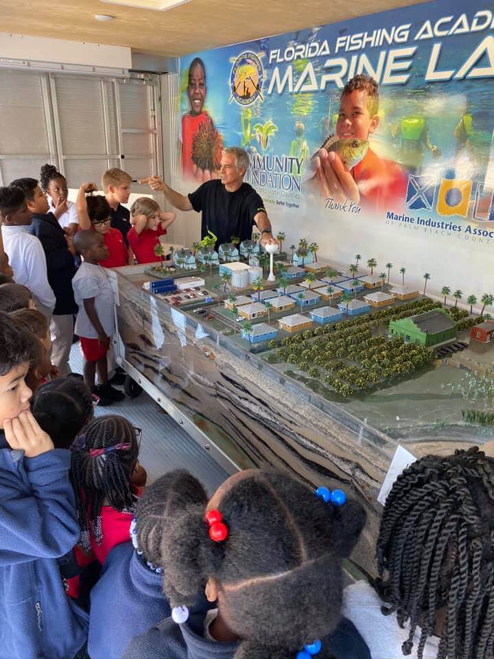 Teaching a class about Florida's watershed and beach erosion.